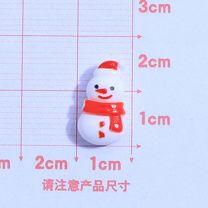 små julfigurer i resin